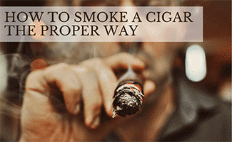 Portrait of brutal man with a cigar and smoke (Caption: How To Smoke A Cigar The Proper Way)