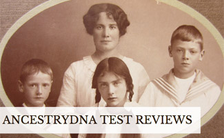 Black and white family photo of two parents and their children (Caption: AncestryDNA Test Reviews)