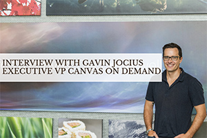 Gavin standing in front of wall (caption: Interview with Gavin Jocius)