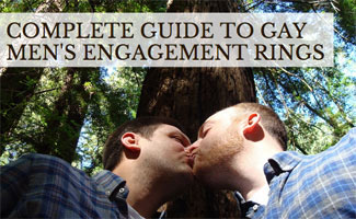 Two men kissing in woods
