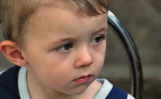 Sad child on playground