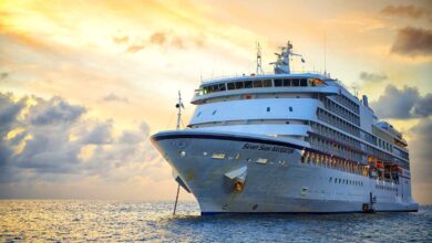 Beautiful marine view with one large cruise liner ship called Regent Navigator of Regent Seveneseas cruise line in port on sunset background.